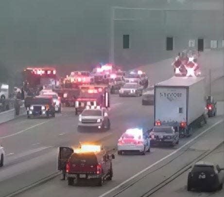 A screenshot from a traffic camera video shows emergency responders at the scene after Trooper Aaron N. Smith was struck and killed by a fleeing driver on Ronald Reagan Parkway in Hendricks County on June 28, 2023.