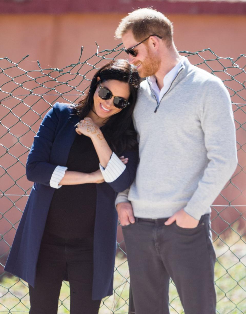 <p>Here, Prince Harry and Meghan share a moment together while on the royal tour of Morocco. The visit was her final international tour before welcoming her first child.</p>