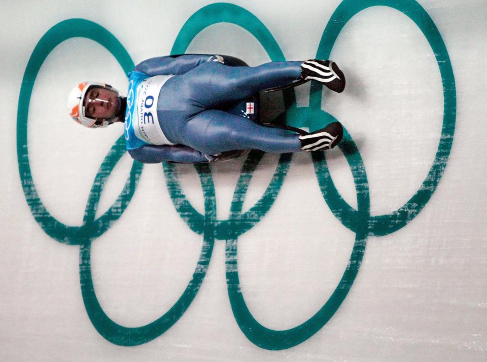 FILE - In this Thursday, Feb. 11, 2010 file photo Nodar Kumaritashvili of Georgia practices during a men's singles luge training run at the Vancouver 2010 Olympics in Whistler, British Columbia, Canada. Four years ago, Olympic luge was forever changed. The horrifying death of Kumaritashvili, an easy-going 21-year-old who was taught to slide by his father and uncle in war-torn Georgia, cast a pall over the Vancouver Games and raised questions about track safety and design. (AP Photo/Elise Amendola, File)