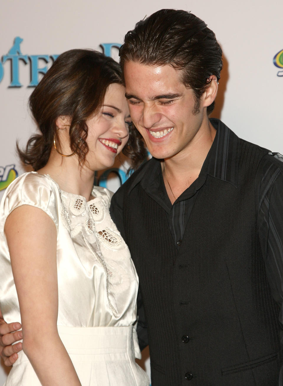 Daniel Samonas and Selena Gomez smiling and standing close together on the red carpet