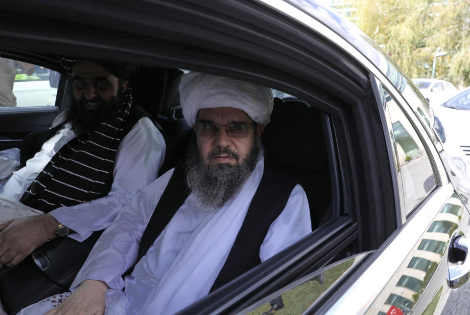 The Taliban delegation led by Amir Khan Muttaqi, the acting foreign minister, rear, sit in a car at Esenboga Airport, in Ankara, Turkey, Thursday, Oct. 14, 2021. A high-level delegation of Afghanistan's new Taliban rulers has arrived in Turkey for talks with Turkish officials, the Foreign Ministry announced Thursday. The meetings in the capital of Ankara would be first between the Taliban and senior Turkish government officials after the group seized control of Afghanistan. (AP Photo/Burhan Ozbilici)