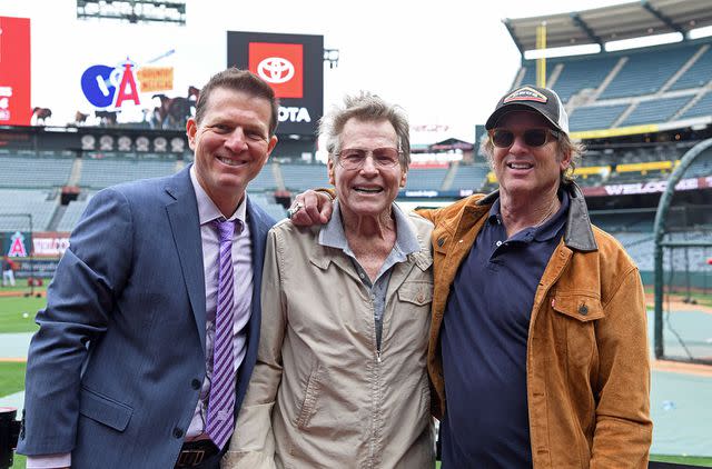 <p>Kevork Djansezian/Getty</p> Patrick O'Neal (left) and Ryan O'Neal (center) with actor/director Hart Bochner in May 2022