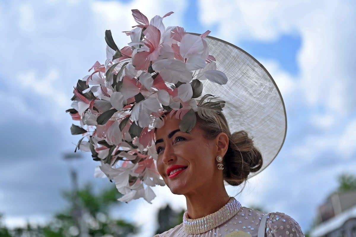 A racegoer poses for a photograph on the second day of the Royal Ascot (AFP via Getty Images)