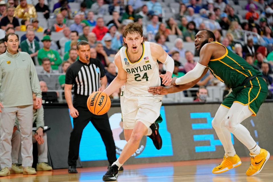 Baylor forward Matthew Mayer drives past Norfolk State guard Joe Bryant Jr., right, in March during an NCAA Tournament game at Dickies Arena in Fort Worth, Texas.