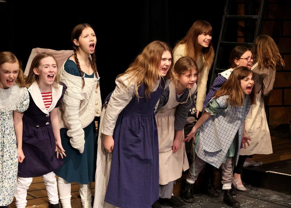 Annie's fellow orphans rail, in song, in "It's a Hard-Knock Life" in the Academy of Performing Arts production of the musical "Annie," through April 7 in Orleans.