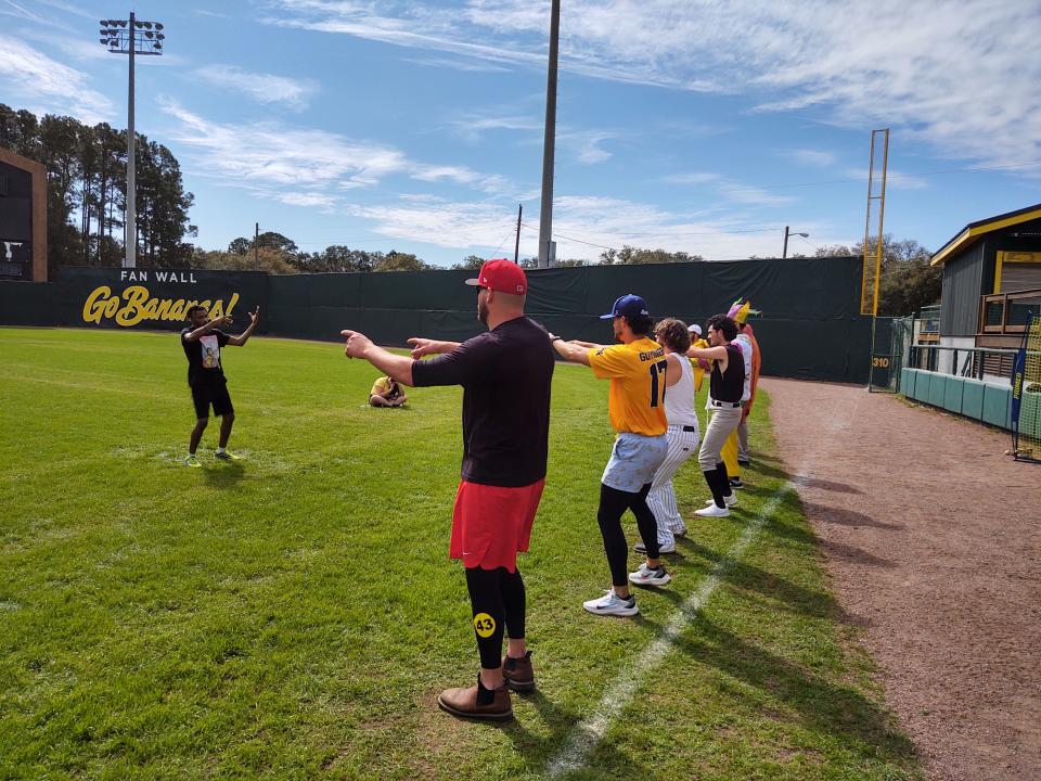 Maceo Harrison, far left, the Savannah Bananas' dancing first base coach, leads prospects including Logan Maxwell (closest to camera) through a dance lesson on Saturday during tryouts for the Premier Team at Grayson Stadium. Maxwell made the team.