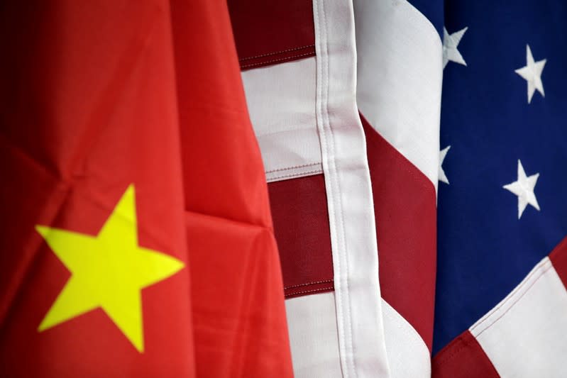 Flags of U.S. and China are displayed at AICC's booth during China International Fair for Trade in Services in Beijing