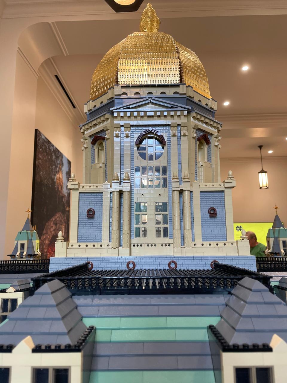 This photo shows the backside of the University of Notre Dame's Golden Dome made of gold Lego bricks on a replica of the Administration Building made of 300,000 Lego bricks now on display on campus in McKenna Hall.