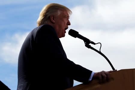 Republican presidential nominee Donald Trump holds a rally at a car dealership in Portsmouth, New Hampshire, U.S. October 15, 2016. REUTERS/Jonathan Ernst