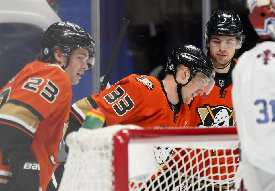 Anaheim Ducks right wing Jakob Silfverberg, center, celebrates after scoring a goal with center Sam Steel, left, and defenseman Ben Hutton in the second period of an NHL hockey game against the Colorado Avalanche, Friday, March 5, 2021, in Denver. (AP Photo/David Zalubowski)