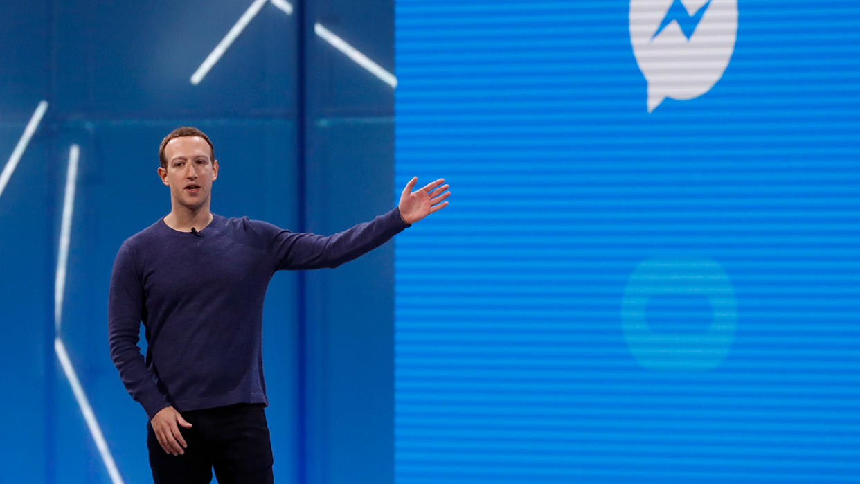 Meta Platforms Executive Chairman Mark Zuckerberg gestures to the Facebook Messenger logo