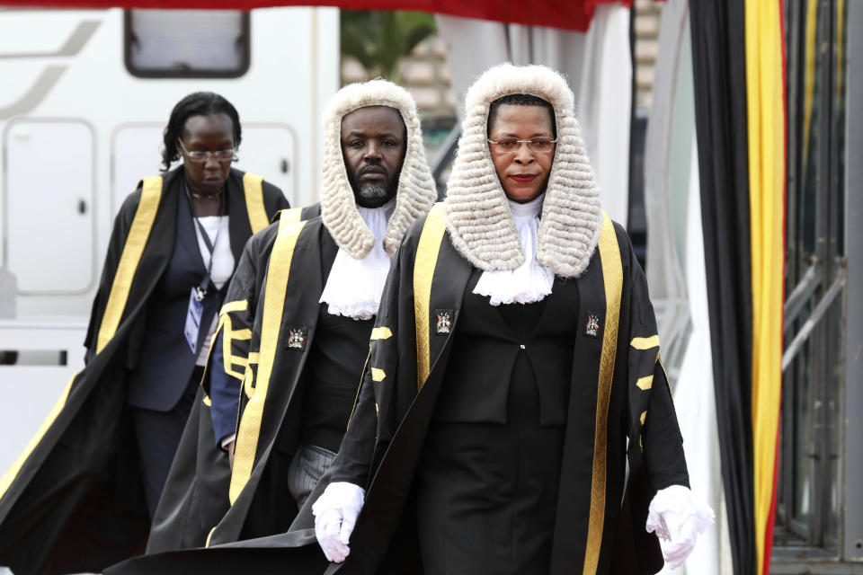 FILE - Speaker of the Parliament of Uganda Anita Among, front, arrive for a 'State of the Nation' address at Kololo independence grounds in Kampala, Uganda, Wednesday, Feb 14, 2024. The United States on Thursday imposed sanctions on Uganda's parliamentary speaker and other officials over alleged corruption and serious abuses of human rights. Speaker Anita Among has been sanctioned "due to involvement in significant corruption tied to her leadership" of the national assembly, a State Department statement said. (AP Photo/Hajarah Nalwadda, File)