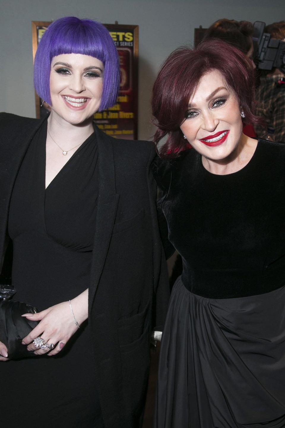 Kelly Osbourne shows of brilliant purple locks while catching a production of <i>Nativity: The Musical </i>with her mom, Sharon, in London on Thursday. 