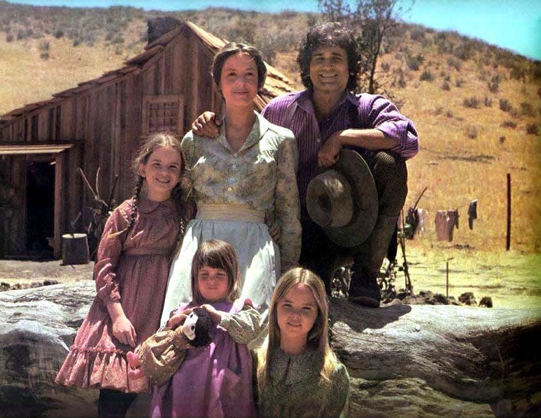 Clockwise from left, Melissa Gilbert, Karen Grassle, Michael Landon, Melissa Sue Anderson, and either Lindsay or Sidney Greenbush (twin girls alternated in one role) are the Ingalls family in "Little House on the Prairie."