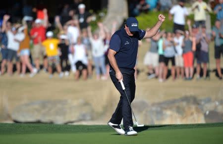 Jan 19, 2019; La Quinta, CA, USA; Phil Mickelson reacts after a birdie putt on the 17th green during the third round of the Desert Classic golf tournament at PGA West - Stadium Course. Mandatory Credit: Orlando Ramirez-USA TODAY Sports