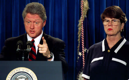 President Clinton, accompanied by Attorney General Janet Reno July 19, 1993. REUTERS/Gary Cameron/File Photo