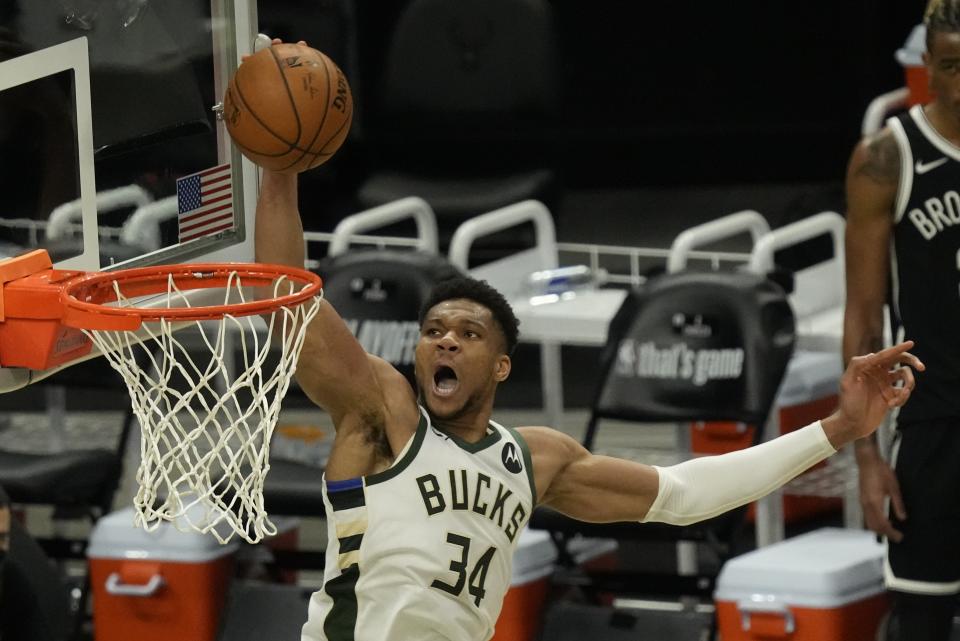 Milwaukee Bucks' Giannis Antetokounmpo dunks during the second half of Game 4 of the NBA Eastern Conference basketball semifinals game against the Brooklyn Nets Sunday, June 13, 2021, in Milwaukee. (AP Photo/Morry Gash)