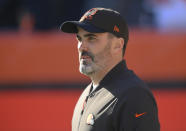 FILE - Cleveland Browns head coach Kevin Stefanski looks on before an NFL football game against the Baltimore Ravens, Dec. 12, 2021, in Cleveland. The NFL's decision to relax some COVID-19 testing policies could result in the Browns getting back some key players in time to play Monday, Dec. 20, 2021, but Stefanski, who is still isolating after a positive test, is not counting on anything. (AP Photo/David Richard, File)