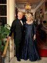 <p>Clarence House released a new photo of Prince Charles and Camilla <a href="https://www.townandcountrymag.com/society/tradition/g25058013/prince-charles-70th-birthday-party-photos/" rel="nofollow noopener" target="_blank" data-ylk="slk:at the prince's 70th birthday celebration;elm:context_link;itc:0;sec:content-canvas" class="link ">at the prince's 70th birthday celebration</a>, which was held at Buckingham Palace. The Duchess of Cornwall is wearing a navy gown by Bruce Oldfield.</p>