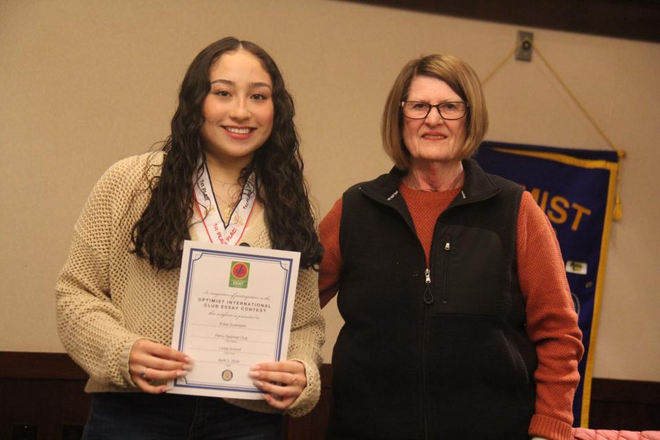 Linda Andorf poses for a photo with Erika Guardado, who won first place in the Perry Optimist Club essay contest.