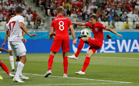 Soccer Football - World Cup - Group G - Tunisia vs England - Volgograd Arena, Volgograd, Russia - June 18, 2018 England's John Stones shoots at goal REUTERS/Toru Hanai