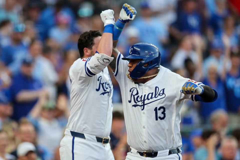 Kansas City Royals catcher Salvador Perez bumps arms with first baseman Vinnie Pasquantino after their back-to-back home runs in the fourth inning of Monday’s game against the Miami Marlins at Kauffman Stadium.