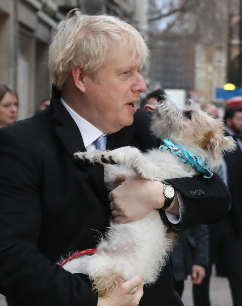 Prime Minister Boris Johnson leaves the polling station with his dog Dilyn after casting his vote in Westminster.