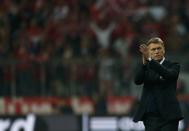 Manchester United's manager David Moyes applauds after their Champions League quarter-final second leg soccer match against Bayern Munich in Munich, April 9, 2014. REUTERS/Michael Dalder (GERMANY - Tags: SPORT SOCCER)