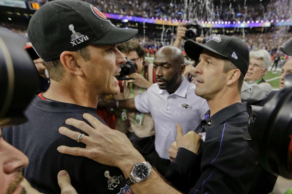 San Francisco 49ers coach Jim Harbaugh (left) greets Baltimore Ravens coach John Harbaugh after Super Bowl XLVII in 2013.