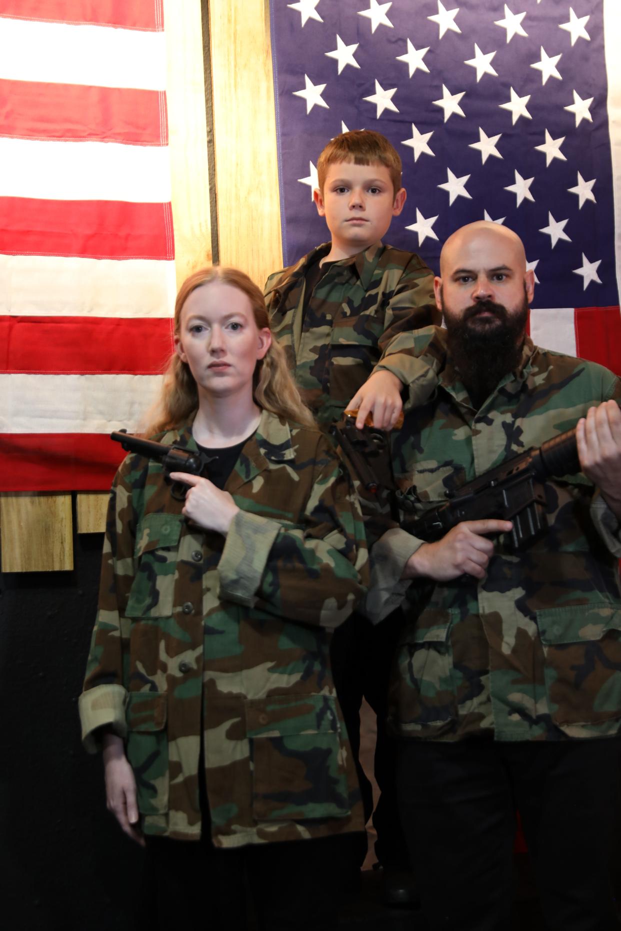 Jeremy Guerrero-Heideman, right, plays the leader of a white supremacist group in Steven Dietz’s play “God’s Country” at Venice Theatre. among other roles, Megan Hendrick, plays his girlfriend, Zillah, and Brennan Reisinger plays their son.