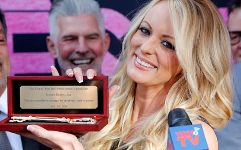 Stormy Daniels shows the Key during the ceremony - Credit: Ringo H.W. Chiu/AP