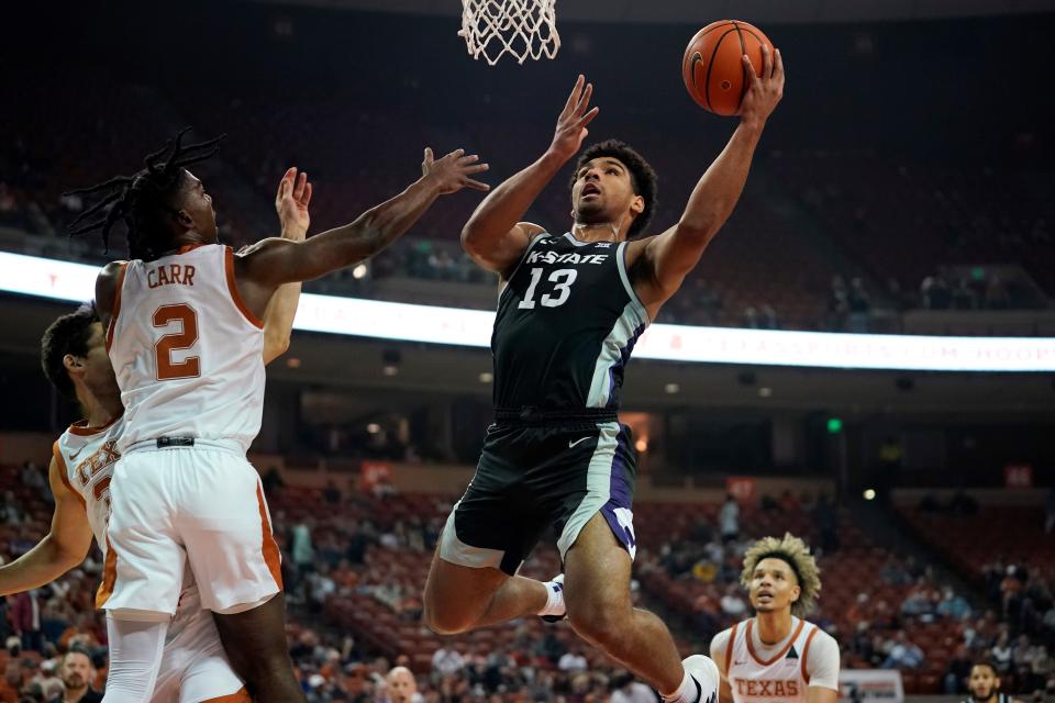 Kansas State guard Mark Smith (13) drives to the basket against Texas' Marcus Carr (2) during the first half Tuesday night at the Frank Erwin Center in Austin, Texas. Smith had 22 points and eight rebounds in leading the Wildcats to a 66-65 victory.