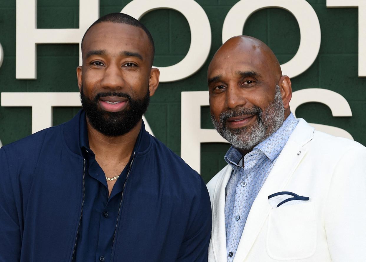 Basketball coach and former professional player Dru Joyce III (L) and his father coach Dru Joyce II (R) attend the Los Angeles premiere of "Shooting Stars" at the Regency Village Theater, in Westwood, California. (Photo by VALERIE MACON / AFP) (Photo by VALERIE MACON/AFP via Getty Images)