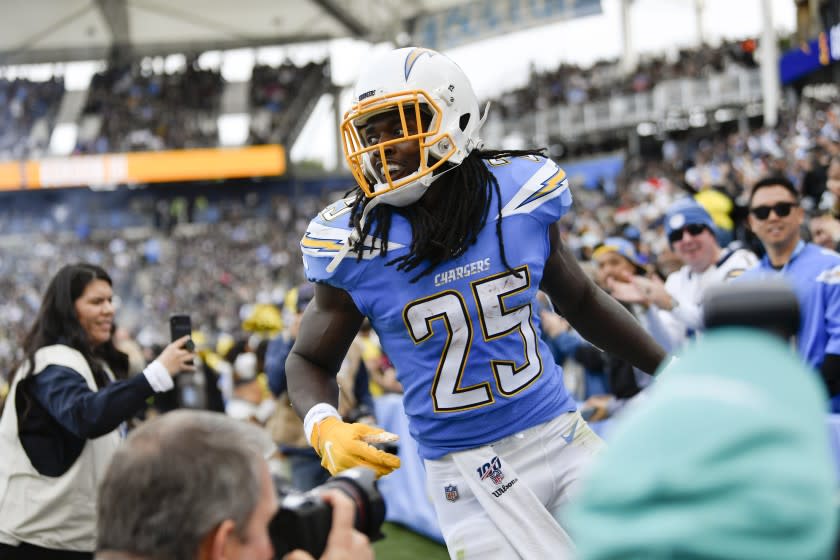 Los Angeles Chargers running back Melvin Gordon celebrates after scoring during the first half of an NFL football game against the Oakland Raiders Sunday, Dec. 22, 2019, in Carson, Calif. (AP Photo/Kelvin Kuo)