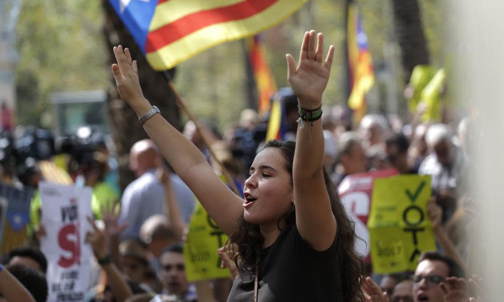 A Catalonia independence flag flies during a protest in Barcelona after police arrested a top official in the region’s economic affairs office.