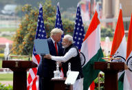 U.S. President Donald Trump and India's Prime Minister Narendra Modi embrace during a joint news conference after bilateral talks at Hyderabad House in New Delhi, India, February 25, 2020. REUTERS/Adnan Abidi