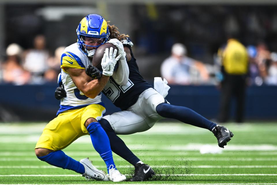 Dallas Cowboys cornerback Josh Butler tackles Los Angeles Rams wide receiver Jordan Whittington during a preseason game at SoFi Stadium. Whittington impressed during the preseason.