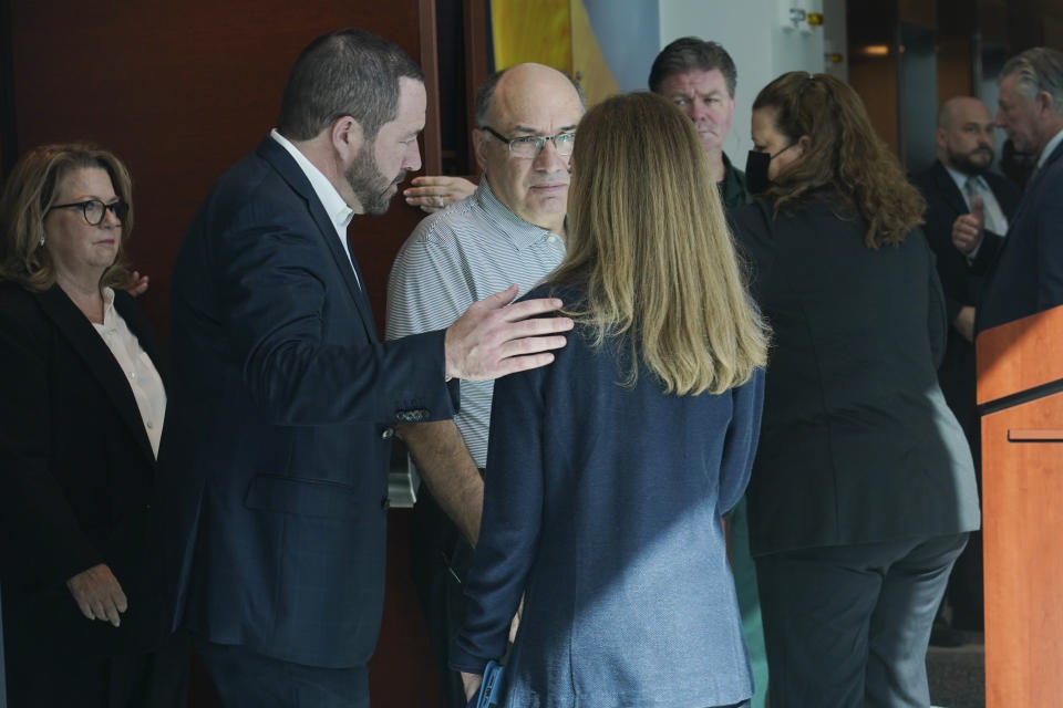 Family members of those killed at Marjory Stoneman Douglas High School shooting enter the a courtroom at the Broward County Courthouse, Tuesday, Oct. 11, 2022, in Fort Lauderdale, Fla. Closing arguments are expected in the penalty trial of Florida school shooter Nikolas Cruz, who faces a possible death sentence for murdering 17 people at Parkland's Marjory Stoneman Douglas High School more than four years ago. (AP Photo/Marta Lavandier, Pool)