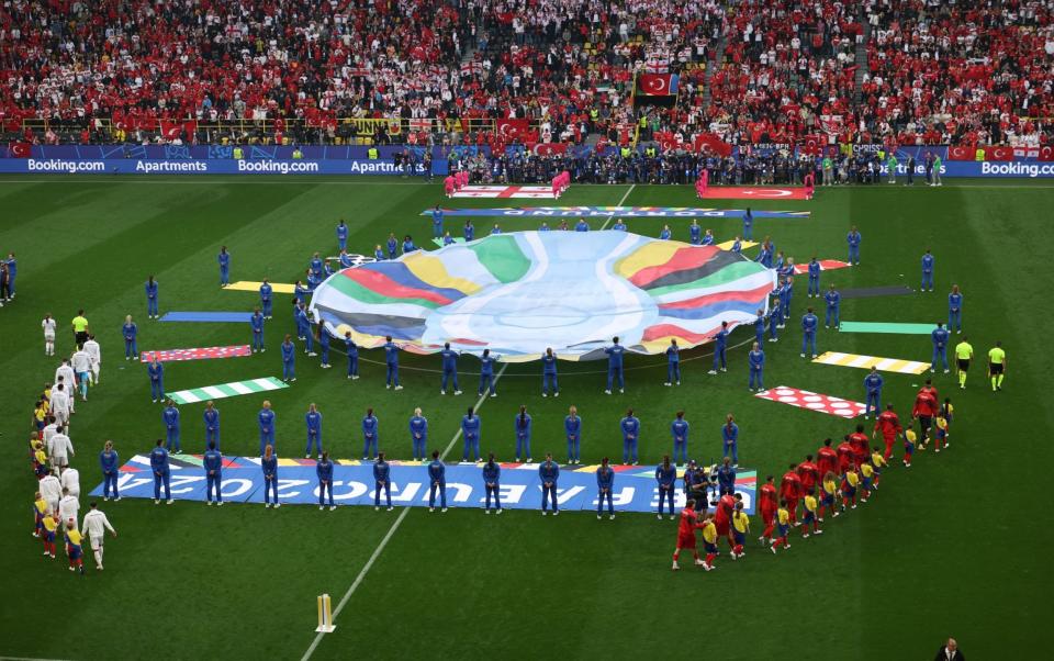 The teams come out for the anthems