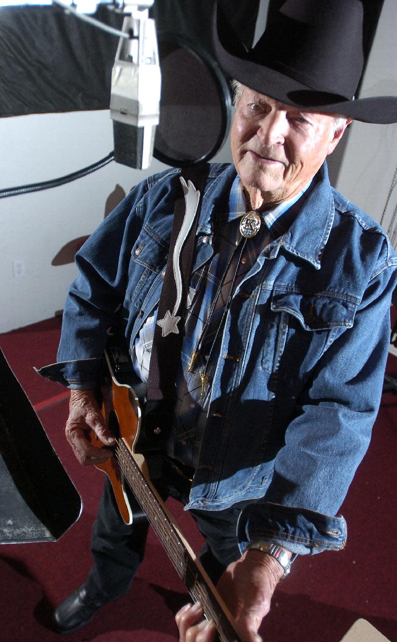 In a Dec. 17, 2007 photo Claude King works on his latest album he is recording at the Red River Studio in Shreveport, La. Country singer-songwriter Claude King, an original member of the Louisiana Hayride who was best known for the 1962 hit "Wolverton Mountain," has died. He was 90. (AP Photo/Douglas Collier/The (Shreveport) Times) (AP Photo/The Shreveport Times,Douglas Collier ) MAGS OUT; MANDATORY CREDIT SHREVEPORTTIMES.COM; NO SALES