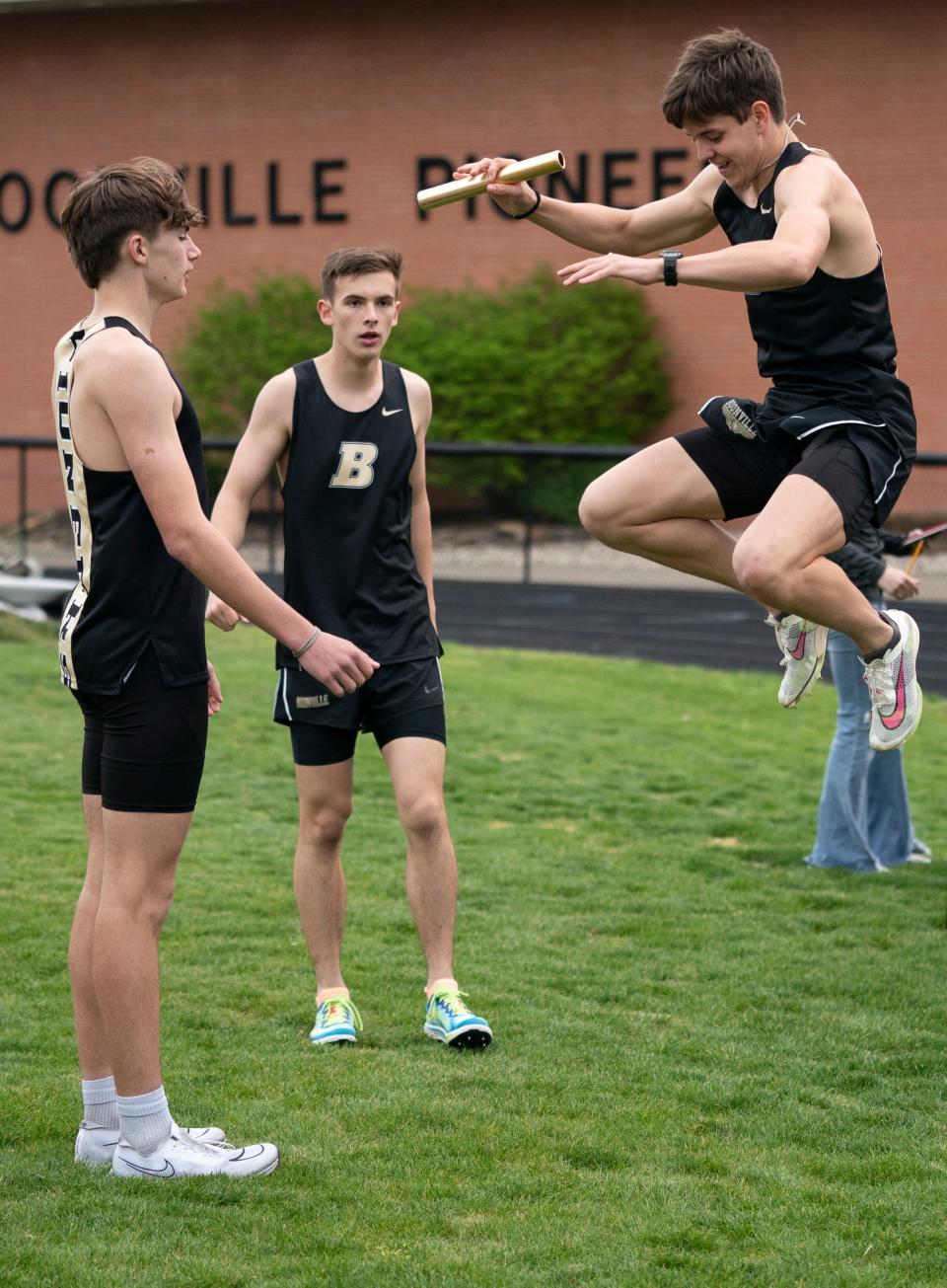 Boonville’s Eli Mayes jumps ahead of the 4x800 meter relay during a track meet in Boonville, Ind., Tuesday, April 9, 2024.