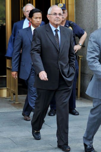 Peter Madoff, the younger brother of convicted Ponzi scheme mastermind Bernard L. Madoff, leaves Federal Court in New York where he pleaded guilty to conspiracy and fraud charges