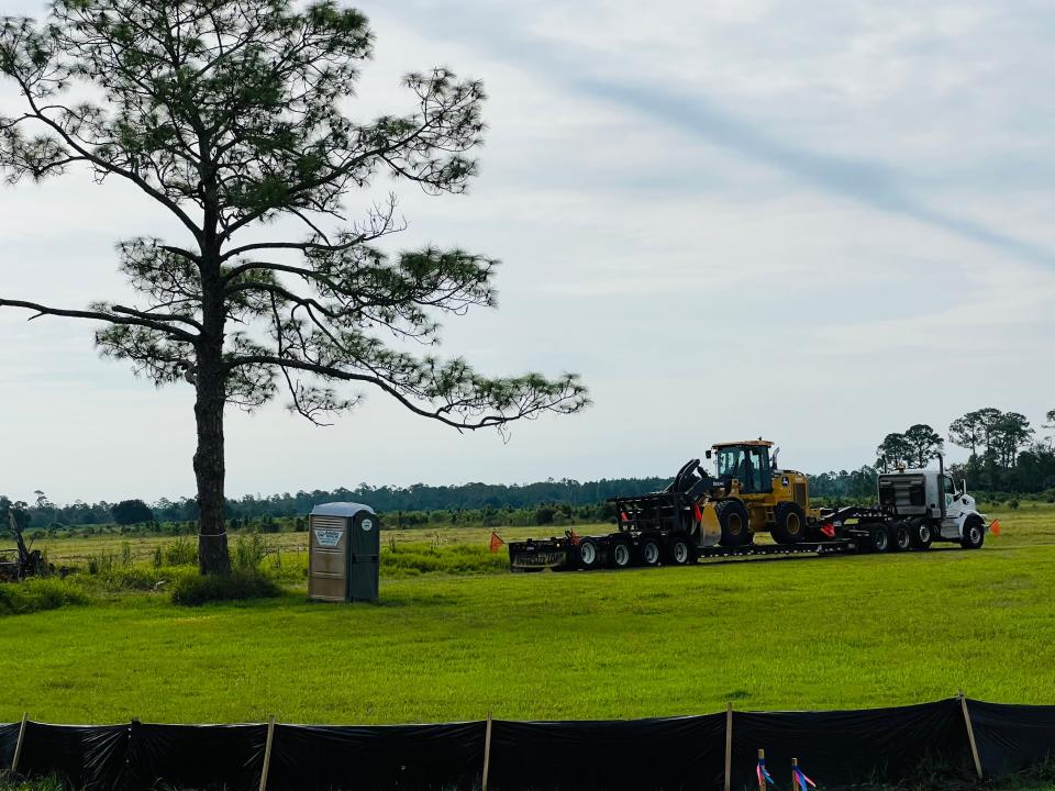 A construction crew gets set to clear more land on the site of the planned 701-home Shell Pointe Colony community along the south side of Pioneer Trail in New Smyrna Beach, Tuesday, Sept. 19, 2023. The future residential subdivision will be just west of Interstate 95.