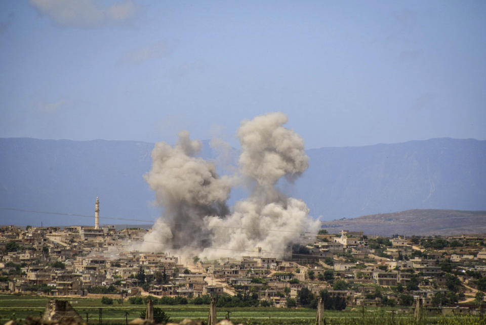 FILE - In this May 3, 2019 file photo, provided by the Syrian Civil Defense White Helmets, which has been authenticated based on its contents and other AP reporting, shows smoke rising after Syrian government and Russian airstrikes that hit the town of al-Habeet, southern Idlib, Syria. Russia said Sunday, May 19, 2019, that Syrian government forces have unilaterally ceased fire in the northern Idlib province, the last major rebel stronghold. Fighting erupted in Idlib last month, effectively shattering a cease-fire negotiated by Russia and Turkey that had been in place since September. (Syrian Civil Defense White Helmets via AP, File)