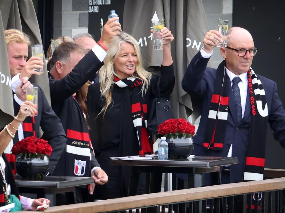 Simone Callahan, pictured here toasting the hearse carrying Shane Warne on a lap of honour.