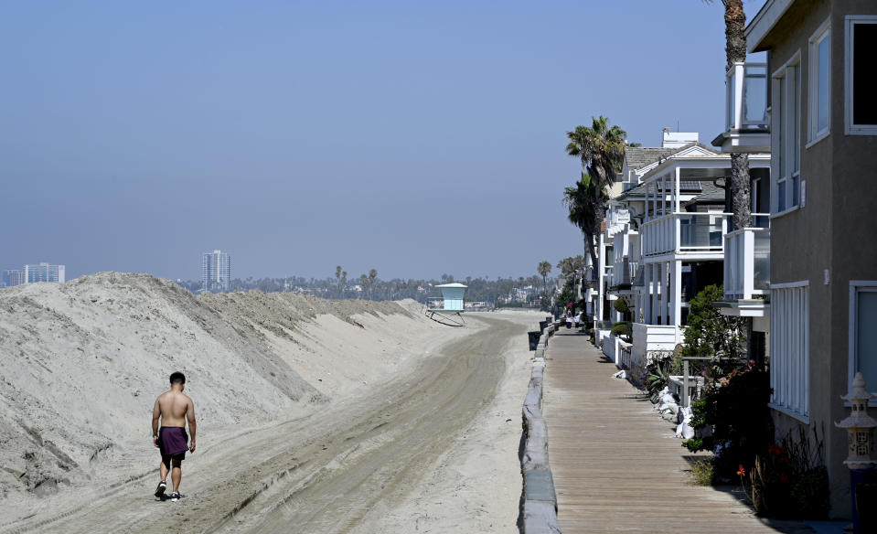 Sand berms are in place along the peninsula in Long Beach on Friday.