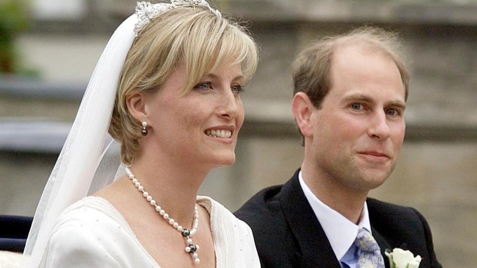 Prince Edward and Duchess Sophie leave in an open carriage following their wedding at St. George's Chapel on June 19, 1999