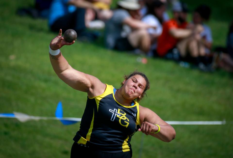 Algona Garrigan's Audi Crooks launches a personal best in the shot put to win the Class 1A championship Thursday at the state high school track and field meet at Drake Stadium.