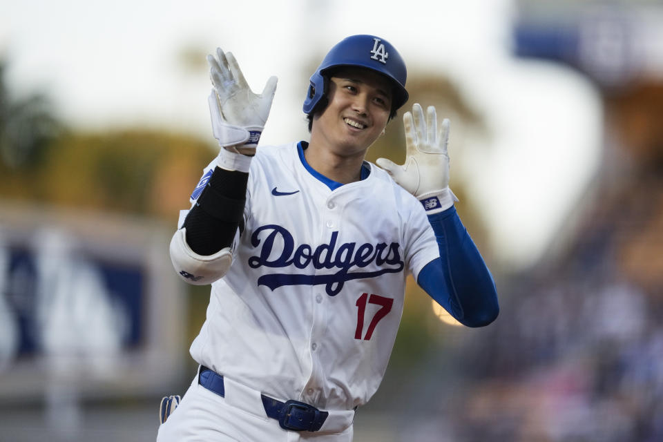 Los Angeles Dodgers two-way player Shohei Ohtani runs the bases after hitting a home run during the first inning of a baseball game against the Miami Marlins in Los Angeles, Monday, May 6, 2024. Mookie Betts also scored. (AP Photo/Ashley Landis)