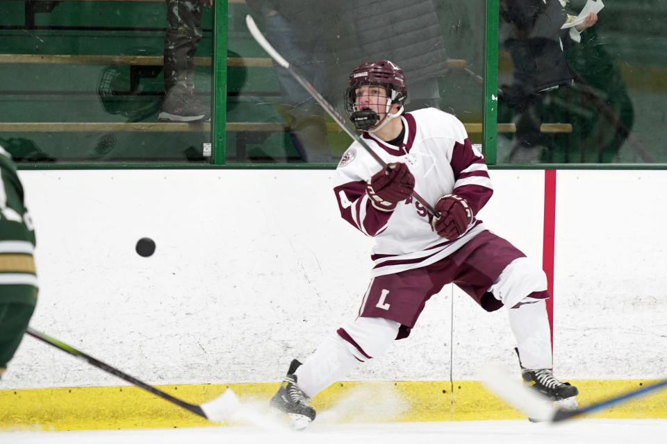 La Salle's Paul Boghosian clears the puck from his zone during Friday's game against Hendricken.